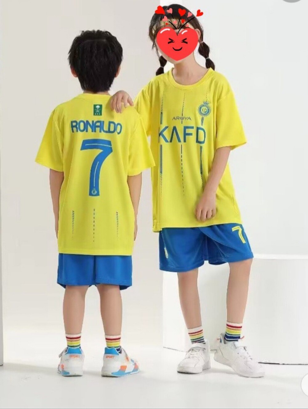 Ronaldo kids size Al Nassr soccer club home uniform.